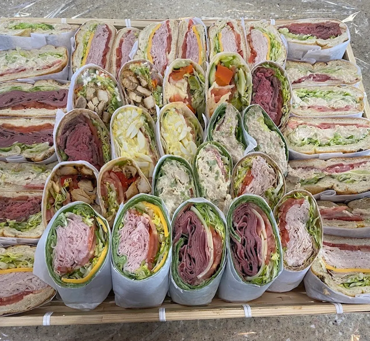 Assorted sandwiches and wraps prepared by Stage Door East Deli